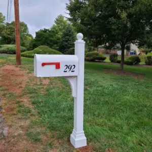 A Janzer Mailbox / Post Installation Package in a grassy area.
