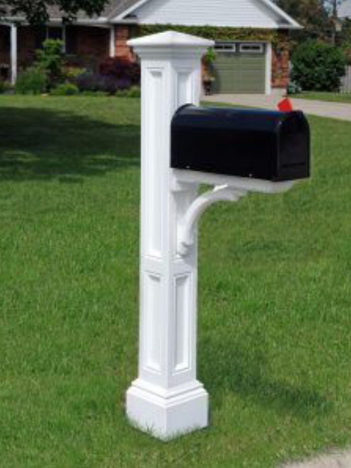 A Mayne Charleston Mail Post With Gibraltor Elite Mailbox - Installation Included in front of a house.