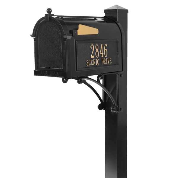 A black mailbox with gold lettering on it.