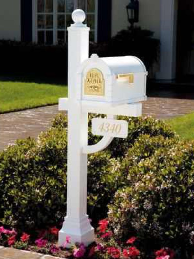 A Gaines Keystone Deluxe - Installation Package - (Cuff Not Included) mailbox in front of a house.