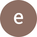 The letter e in a brown circle.