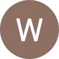 The letter w in a brown circle.