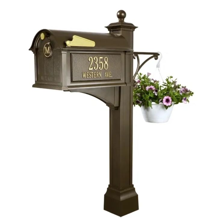 A mailbox with a flower pot on it.